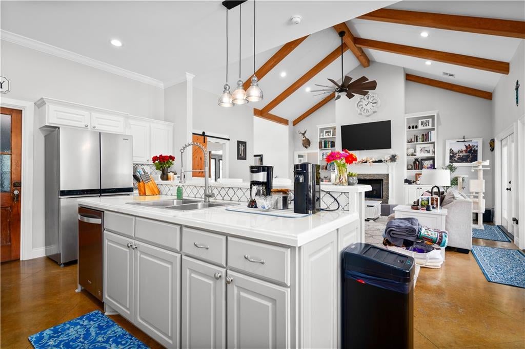 Bright open kitchen with a large island, an example of a well-staged listing