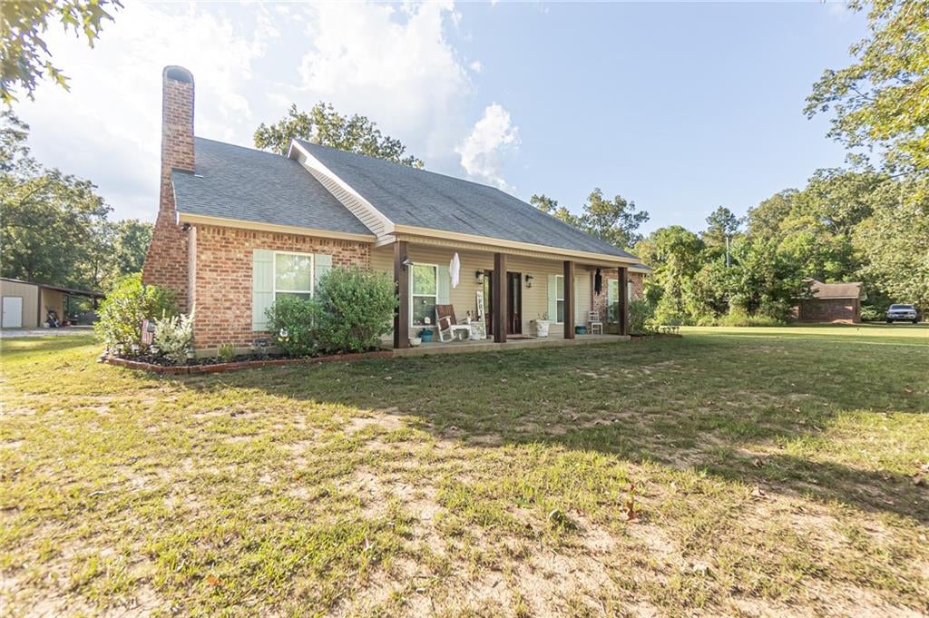 Brick home with front porch at 595 Nation Rd, Deville, LA