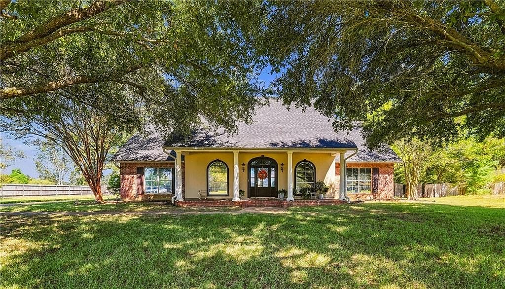 Acadian-style home with columned front porch at 130 Pecan Row Ln, Alexandria, LA