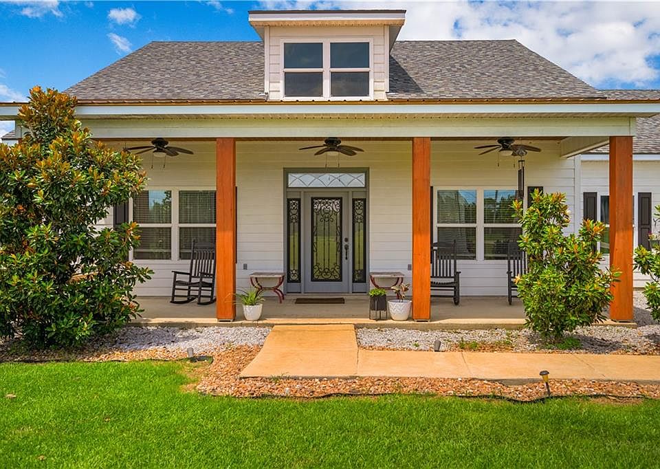 Covered front porch with rocking chairs