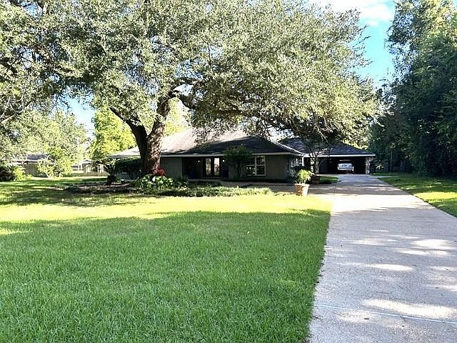 Brick ranch home under live oak trees at 1805 Yupon Dr, Alexandria, LA